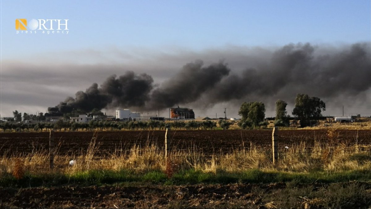 Columns of smoke rise from oil facilities near the town of Tirbe Spiyeh (al-Qahtaniya) in the eastern countryside of Qamishli in NE_Syria due to Turkish airstrikes